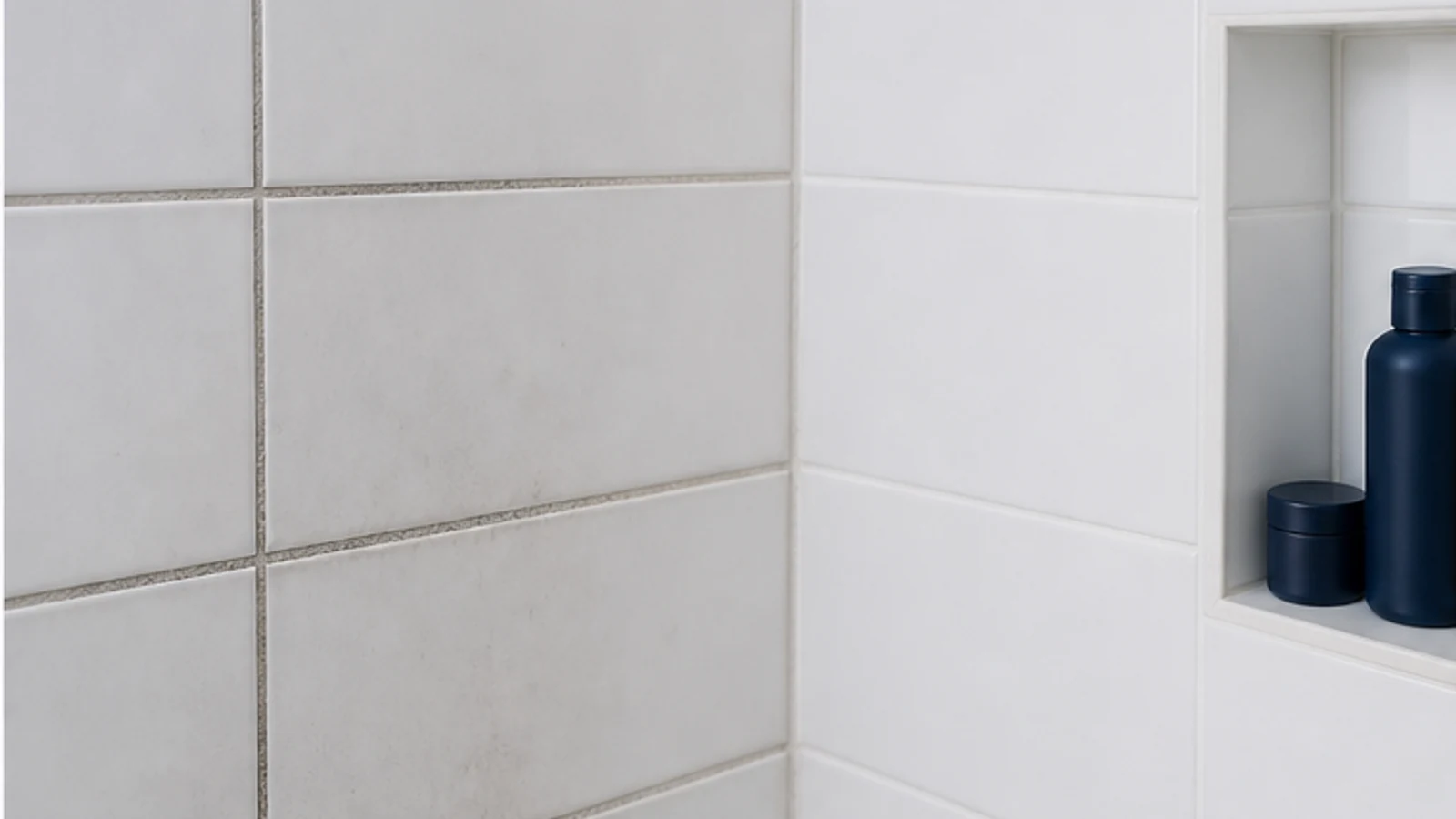 Before and after view of a bathroom shower corner showing darkened grout lines transformed to white clean grout.