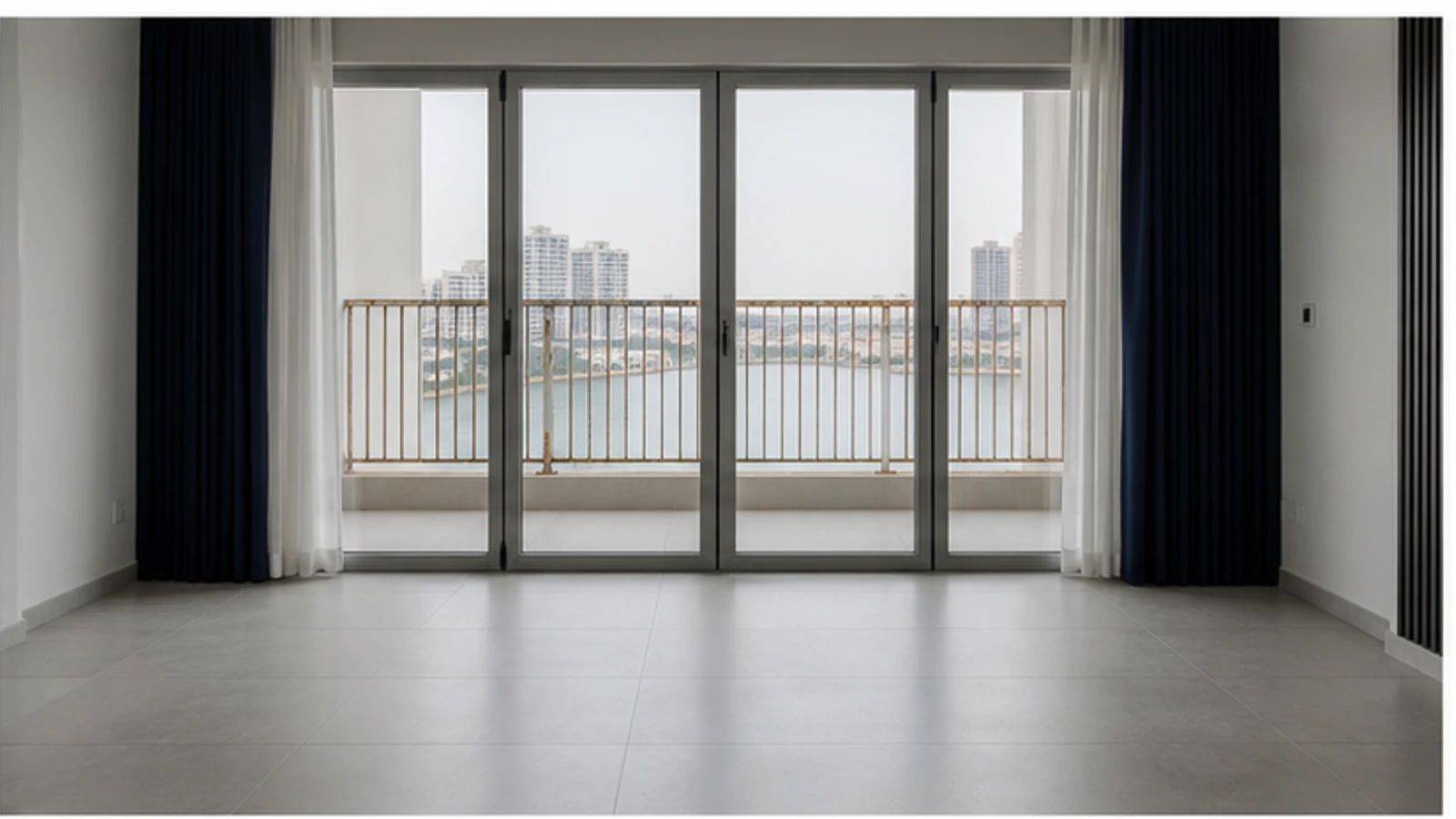 Closed balcony access with the rusty railing visible beyond while qualified inspection is pending.