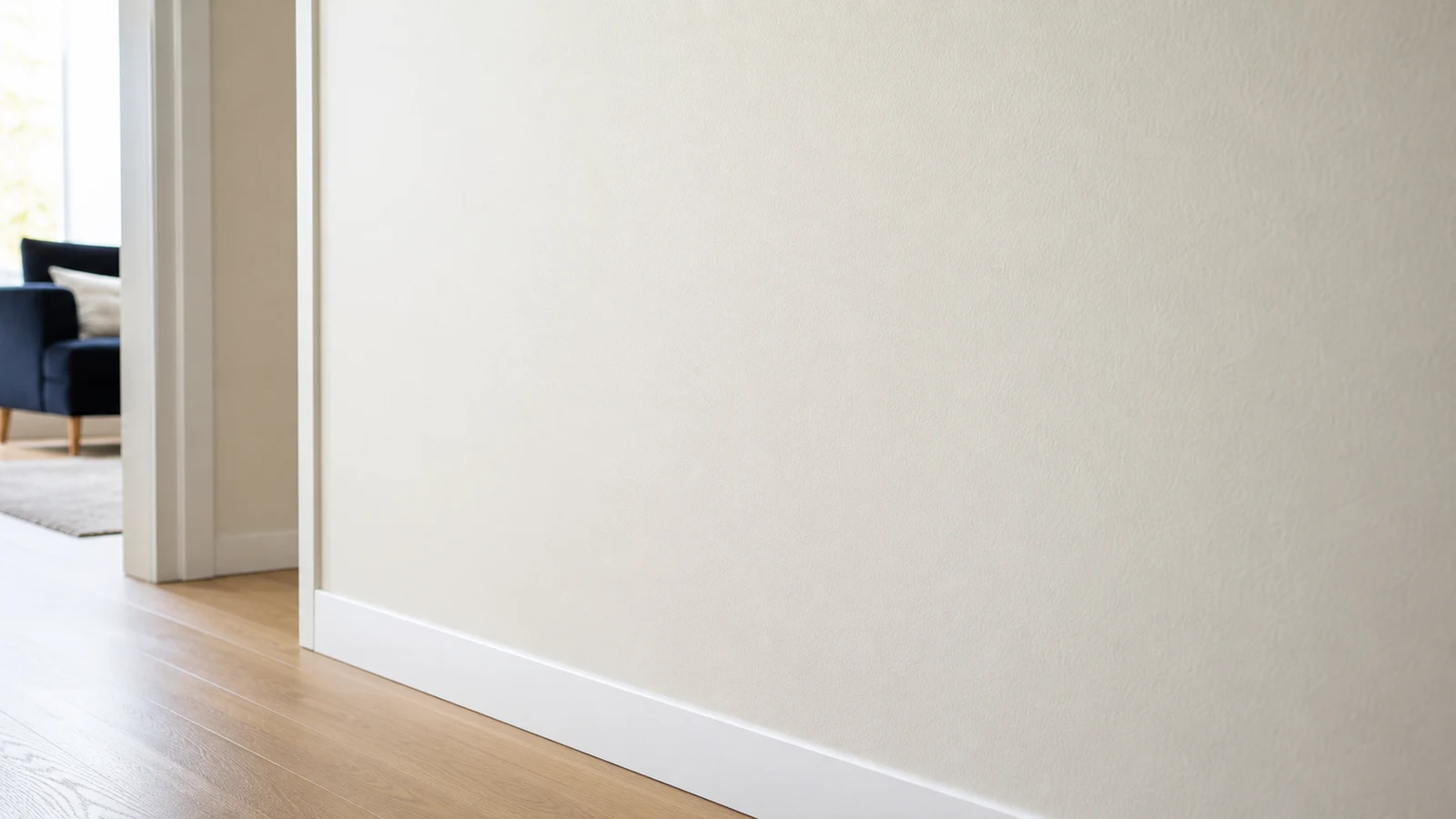Wide view of cleaned wall section under natural light, showing uniform paint finish with no visible scuff or dull spot